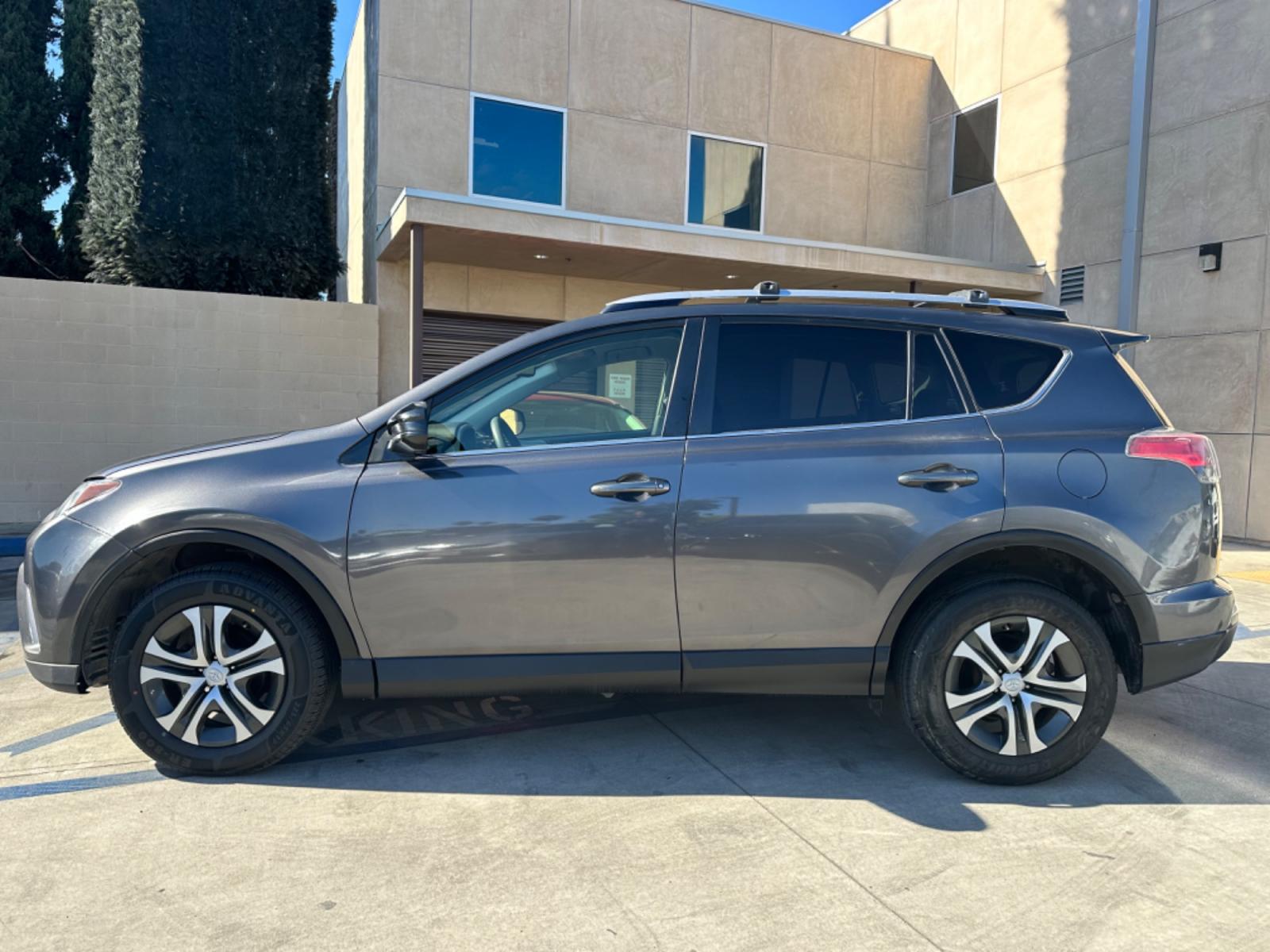 2016 Gray /Black Toyota RAV4 (JTMZFREVXGJ) , AUTOMATIC transmission, located at 30 S. Berkeley Avenue, Pasadena, CA, 91107, (626) 248-7567, 34.145447, -118.109398 - Crown City Motors is a used “Buy Here Pay Here” car dealer in Pasadena CA. “Buy Here Pay Here” financing, means that when you purchase your vehicle from our dealership, that you make the payments to the dealership as well. We do not need the banks approval to get you approved for a used auto - Photo #1